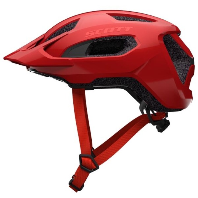 Červená cyklistická helma s odnímatelným kšiltem a integrovanou sítí pro silnici i terén